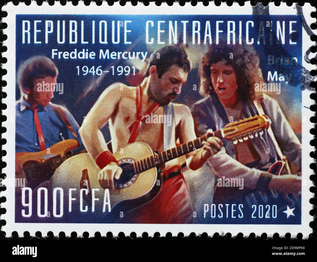 Band the Queen in concert on postage stamp Stock Photo