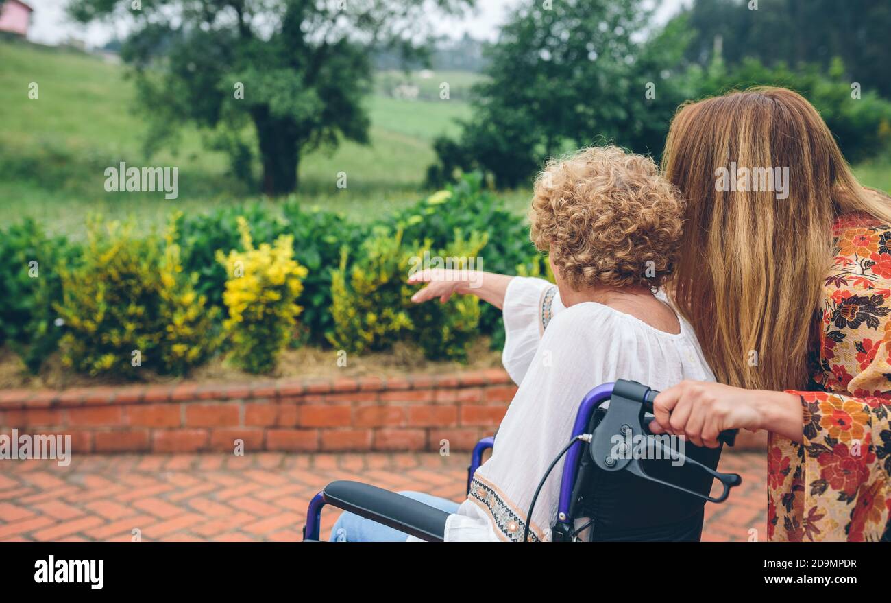 Woman in wheelchair watching hi-res stock photography and images - Alamy