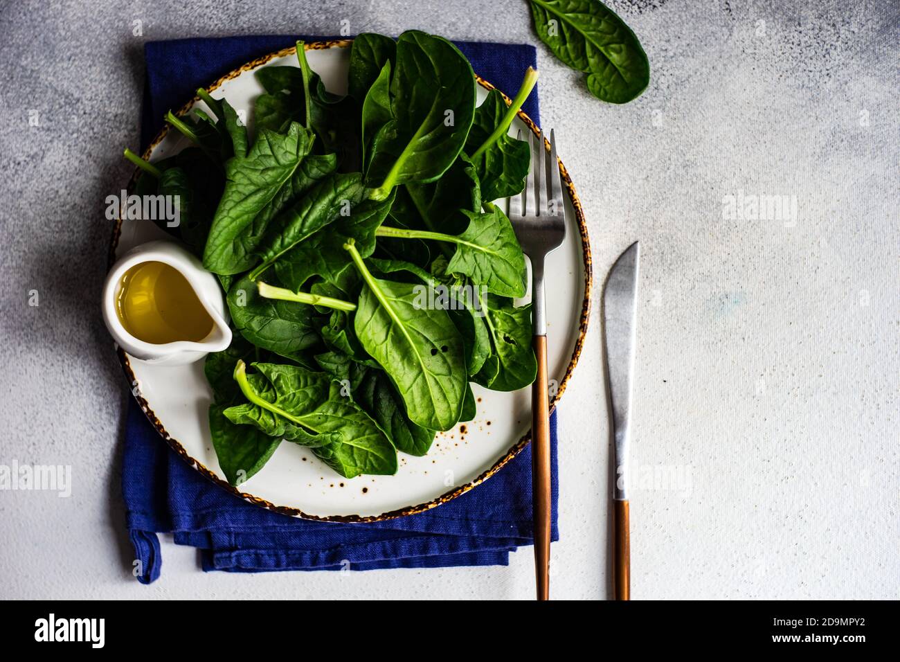 Organic food concept with fresh baby spinach leaves for healthy salad ...