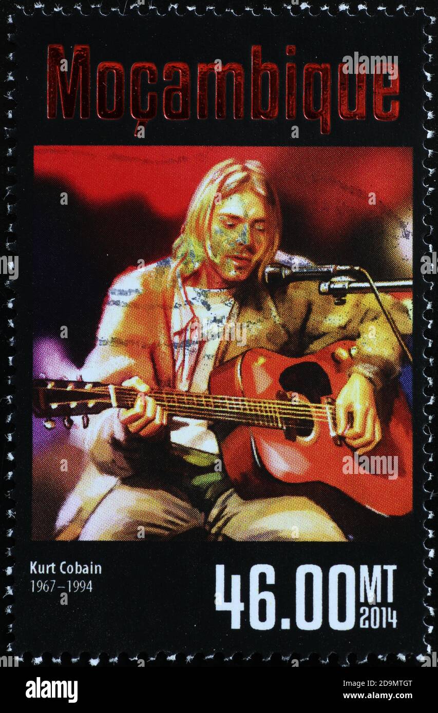 Kurt Cobain playing the guitar on postage stamp Stock Photo