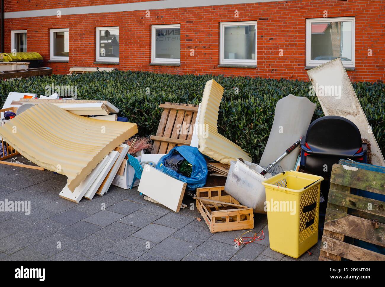 Muenster, North Rhine-Westphalia, Germany, Sperrmuell on the pavement in front of a house in the city center in times of the corona crisis. Stock Photo