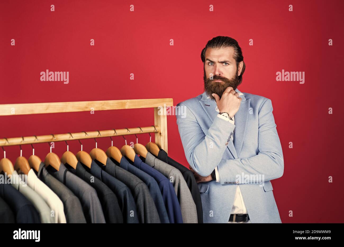 Large Selection Of Mens Suits Bearded Man Choose Jacket On Hanger Male Wardrobe Concept Man Go Shopping In Clothing Store Our Studio Atelier Presents Any Fashion Style Stock Photo Alamy
