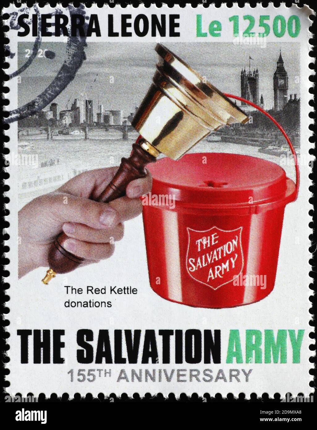 The red kettle donations to Salvation Army on stamp Stock Photo