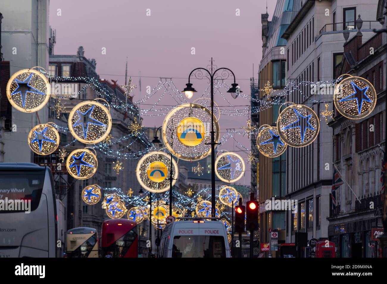 Christmas lights in the Strand, London, UK, at dusk. Main retail road