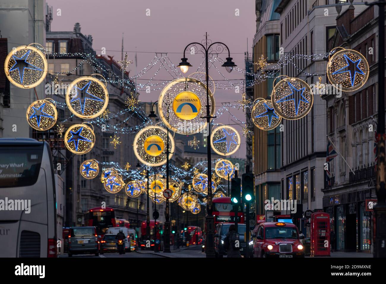 Christmas lights in the Strand, London, UK, at dusk. Main retail road