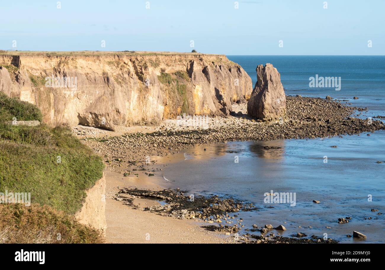 Looking north along the beach and cliffs at Ryhope towards a sea stack, north east England, UK Stock Photo