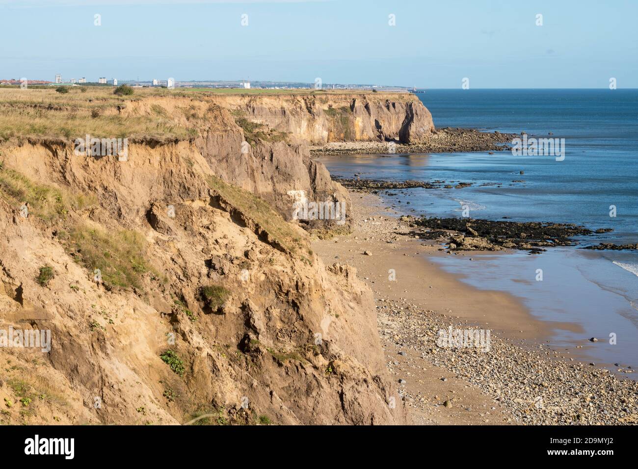 Cliff top erosion seen from the England Coast Path looking north between Seaham and Ryhope, north east England, UK Stock Photo