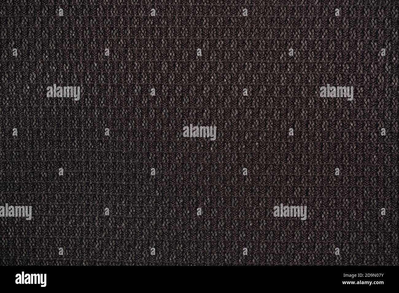 Black nylon fabric textured background with hexagonal shape Stock Photo