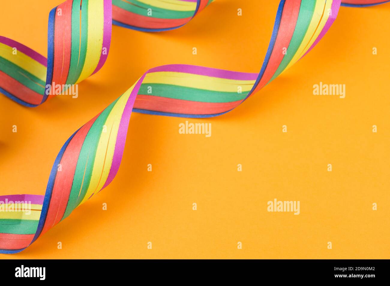 Streamers on orange background Stock Photo Alamy