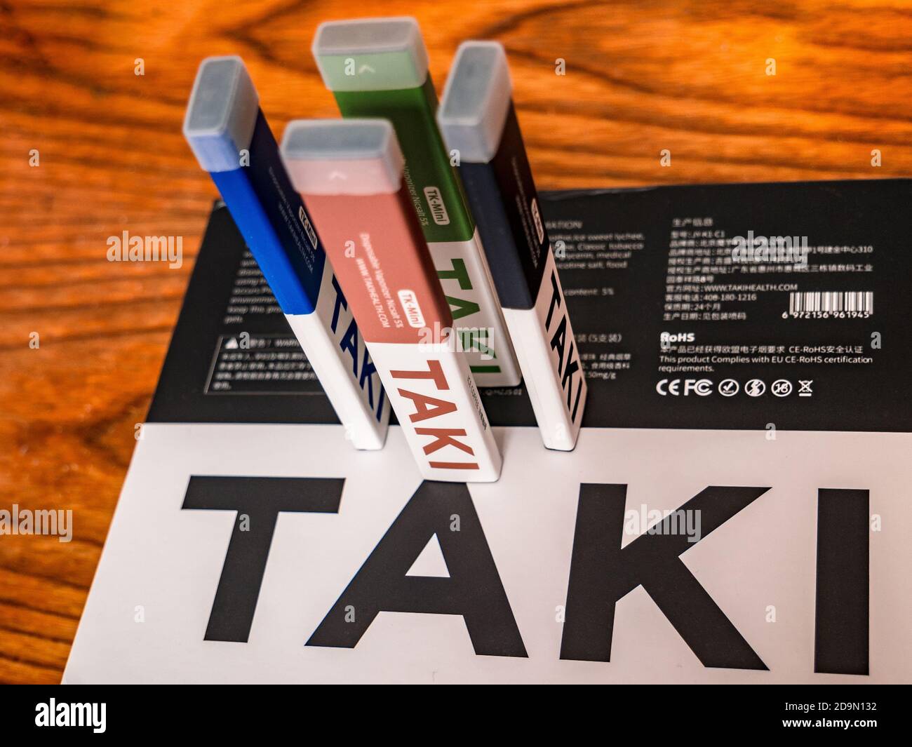 Usti nad Labem / Czech Republic - 30.9.2019: Modern disposable electronic  cigarettes XIAOMI TAKI, standing on the packaging on a wooden background  Stock Photo - Alamy