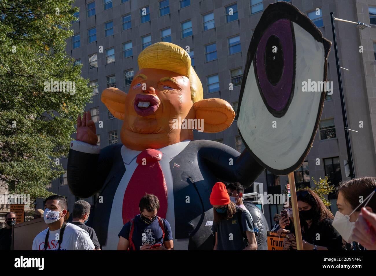 Washington, United States. 06th Nov, 2020. A balloon in the likeness of President Donald Trump is in the background during an 'Every Vote Counts' march from McPherson Square BLM Plaza next to Lafayette Park bordering the White House in Washington, DC on Friday, November 6, 2020. Democratic presidential candidate Joe Biden and President Donald Trump are locked in a tight presidential race. Photo by Ken Cedeno/UPI Credit: UPI/Alamy Live News Stock Photo