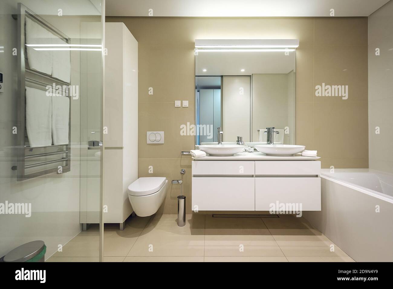 Interior of stylish bathroom with toilet bowl Stock Photo - Alamy