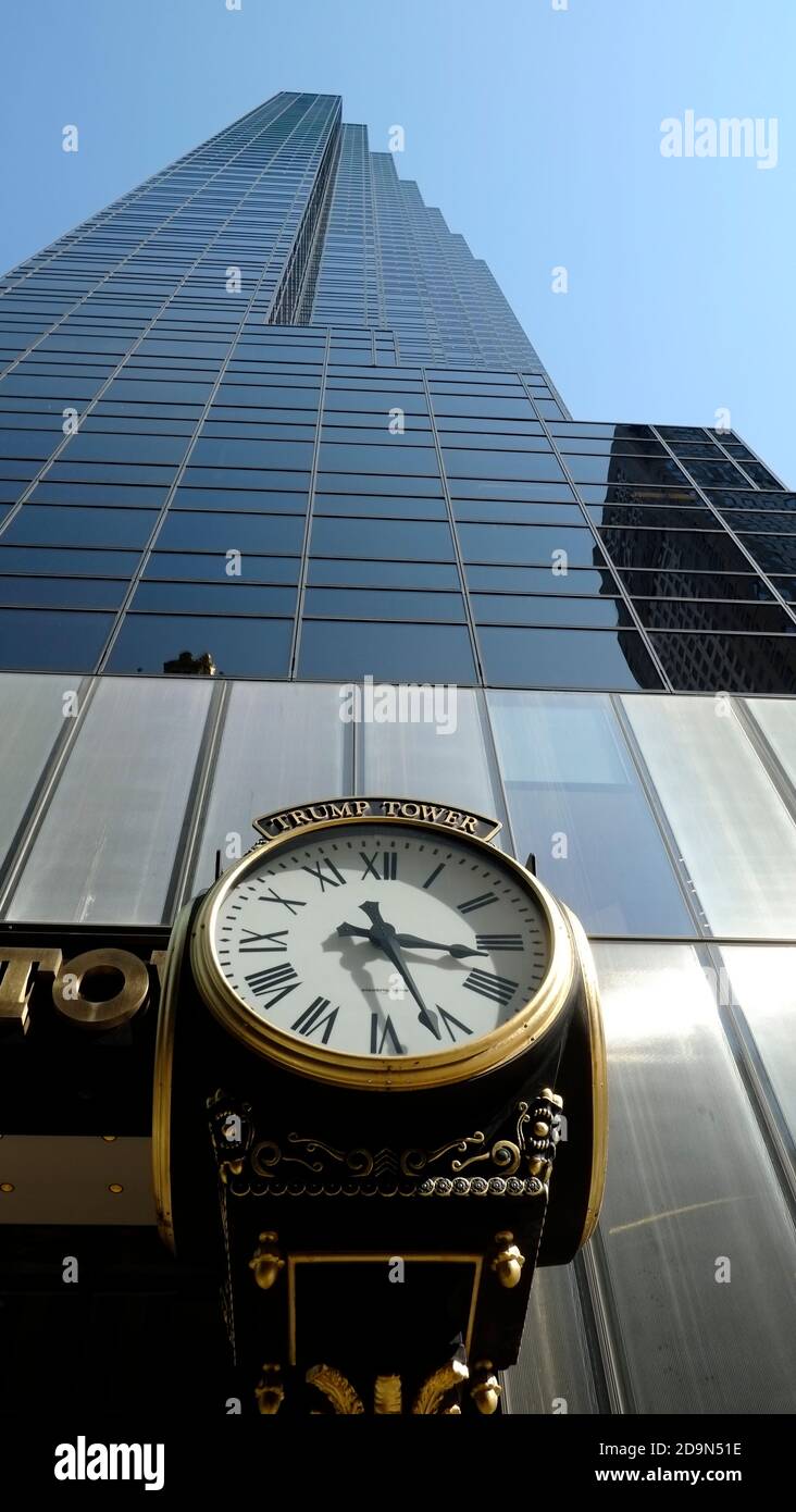 Trump Tower located at 721-725 Fifth Avenue designed by Architects Der Scutt of Poor, Swanke, Hayden & Connell, This mixed-used 202 meters skyscraper housed penthouse apartment residence for President Donald Trump, Old style clock shows time of 3:22 PM, Stock Photo