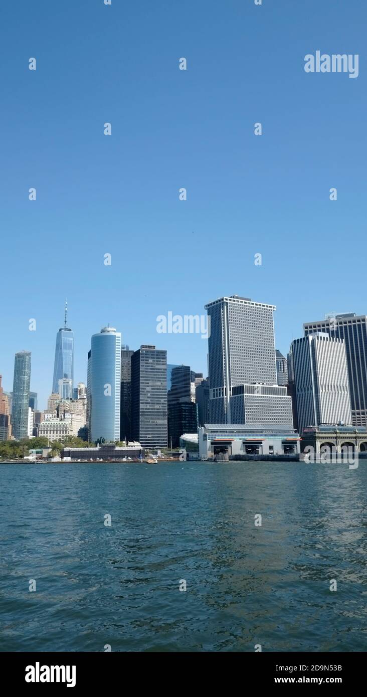 Wall Street office towers with One World Trade Center, designed by David Childs from Skidmiore, Owings & Merril photographed from Staten Island Ferry Stock Photo