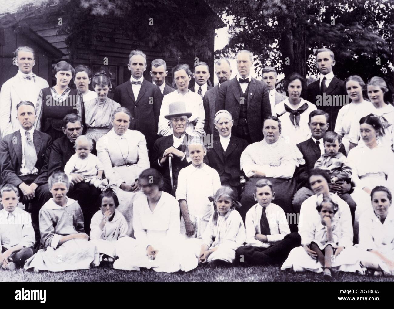 1900s GROUP PORTRAIT OF MULTI-GENERATION FAMILY GATHERED AROUND MAN PATRIARCH FOR REUNION PHOTOGRAPH ALL LOOKING AT CAMERA - ko2594 HAR001 HARS COLOR MOTHERS SENIORS OLD TIME FUTURE NOSTALGIA OLD FASHION JUVENILE YOUNG ADULT GENERATIONS INFANT FAMILIES JOY LIFESTYLE CELEBRATION ELDER FEMALES MARRIED RURAL SPOUSE HUSBANDS HOME LIFE COPY SPACE FRIENDSHIP HALF-LENGTH LADIES PERSONS MALES TEENAGE GIRL TEENAGE BOY SENIOR MAN SENIOR ADULT FATHERS REUNION 1800s PARTNER EYE CONTACT SENIOR WOMAN HAPPINESS OLD AGE OLDSTERS OLDSTER TURN OF THE 20TH CENTURY DADS PRIDE YOUNG AND OLD GENERATION Stock Photo
