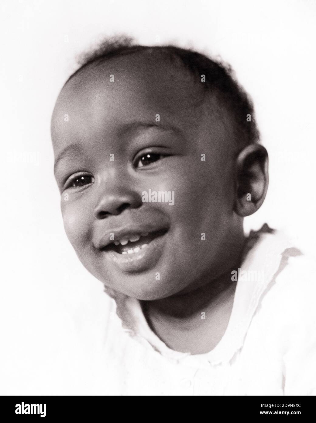 1940s PORTRAIT SMILING AFRICAN-AMERICAN BABY BOY - n221 HAR001 HARS BLACK ETHNICITY SMILES JOYFUL BABY BOY PLEASANT AGREEABLE CHARMING GROWTH JUVENILES LOVABLE PLEASING ADORABLE APPEALING BLACK AND WHITE HAR001 OLD FASHIONED AFRICAN AMERICANS Stock Photo