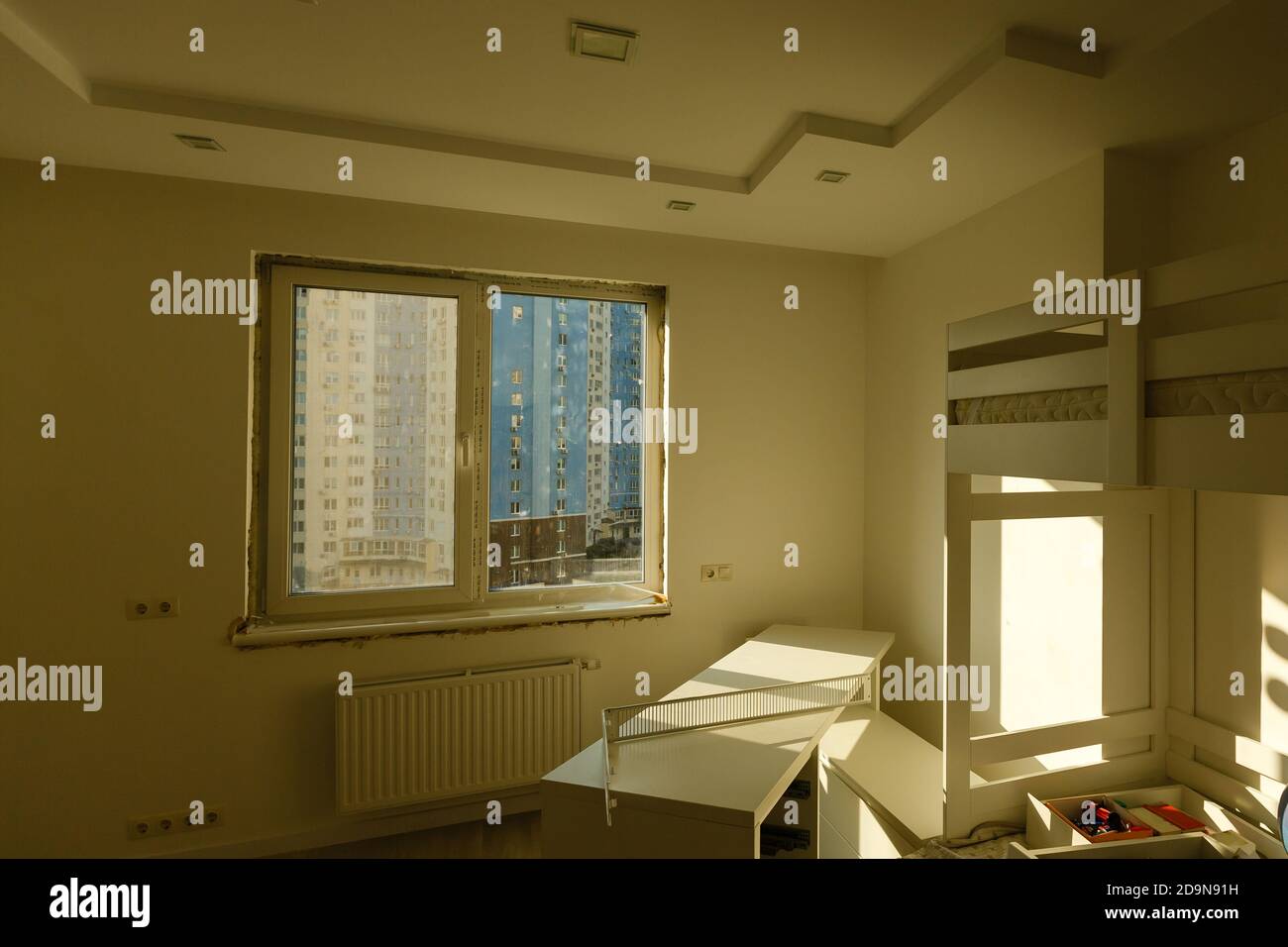 Process installation slopes of window. Using a moanting foam. Stock Photo