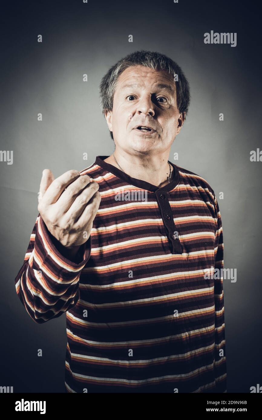 Solid middle aged man studio portrait on grey background Stock Photo