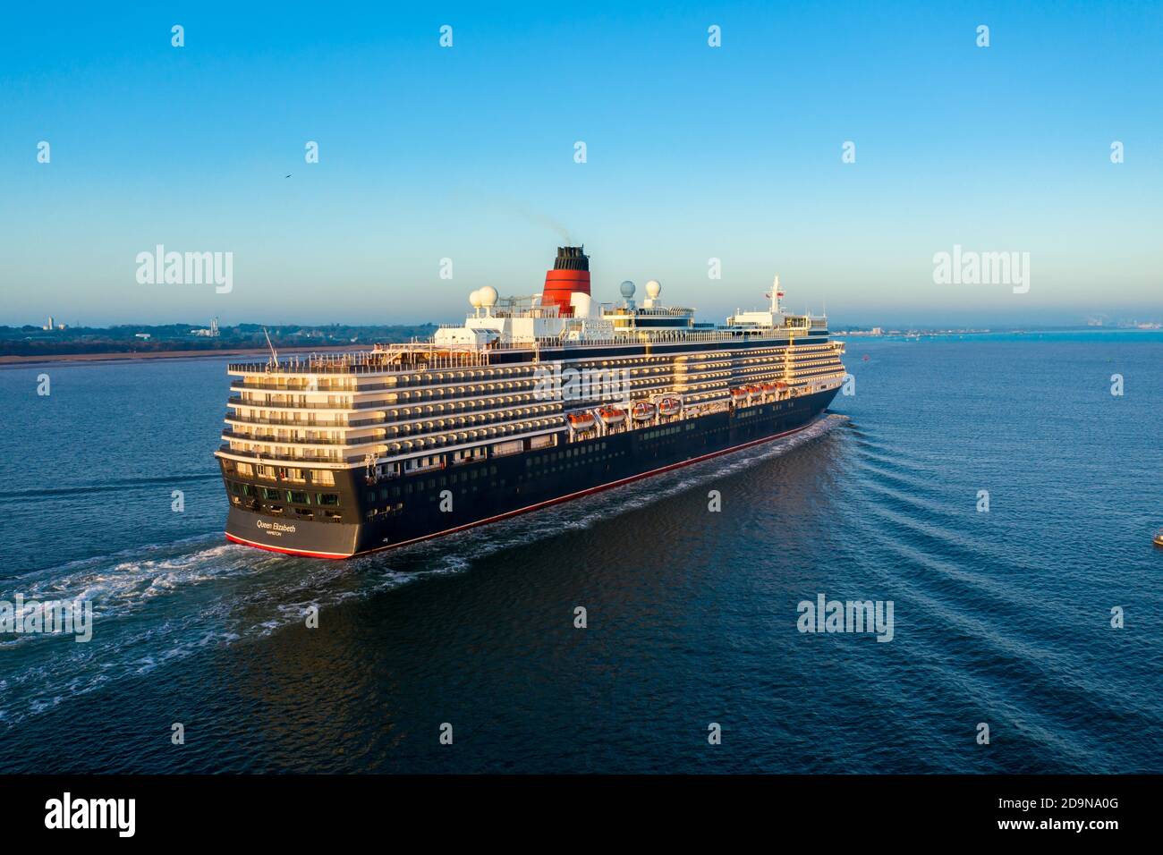 MS Queen Elizabeth is a cruise ship of the Vista class operated by the Cunard Line. Queen Elizabeth arriving at Southampton port empty due to pandemic Stock Photo