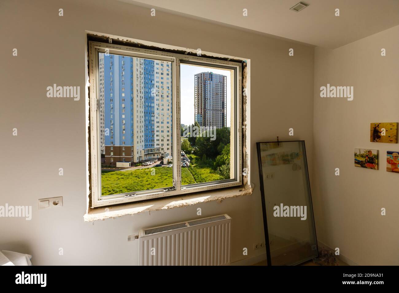 Process installation slopes of window. Using a moanting foam. Stock Photo