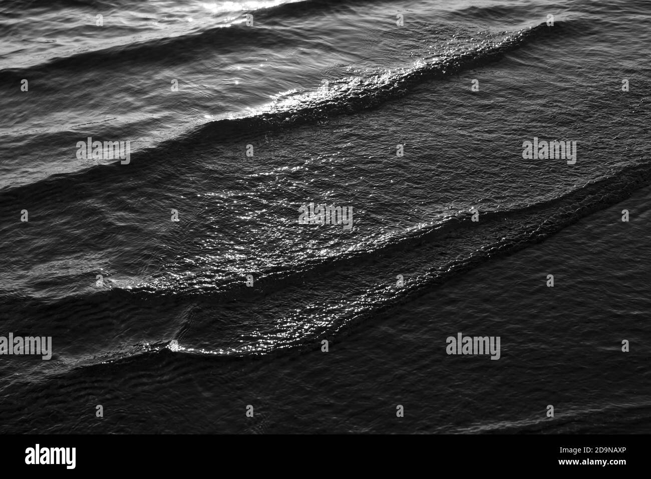 Natural background and glare on the surface of the sea. Small waves in ...
