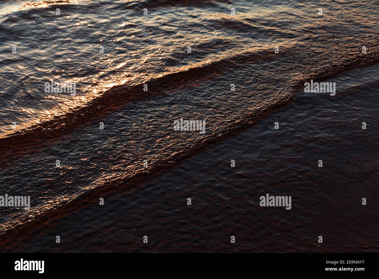 Natural background and glare on the surface of the sea. Small waves in ...