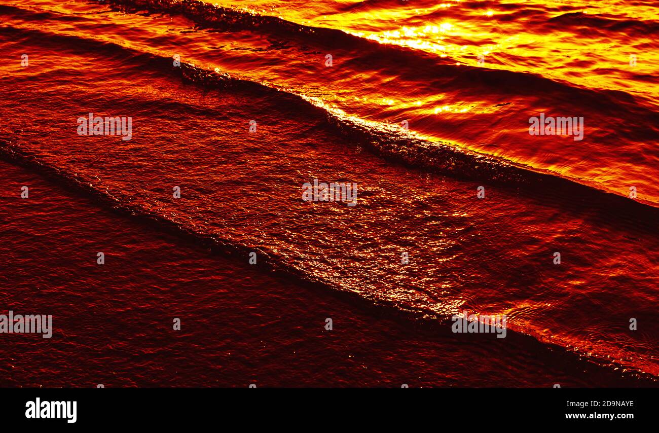Natural background and glare on the surface of the sea. Small waves in ...