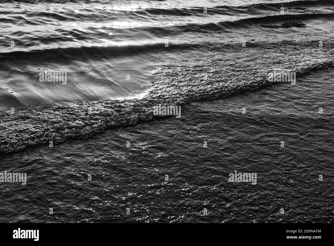 Natural background and glare on the surface of the sea. Small waves in ...