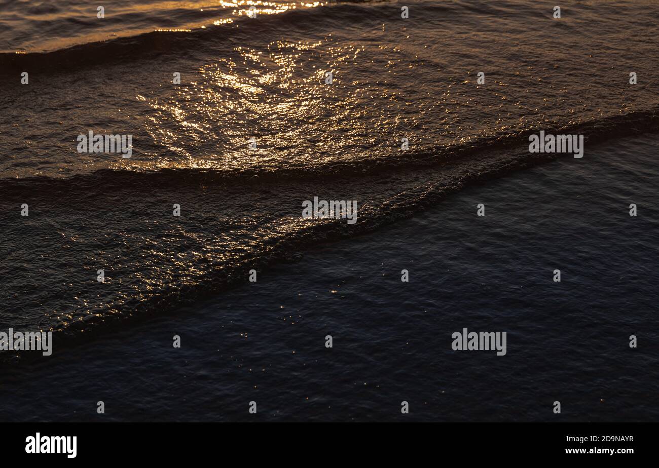 Natural background and glare on the surface of the sea. Small waves in ...
