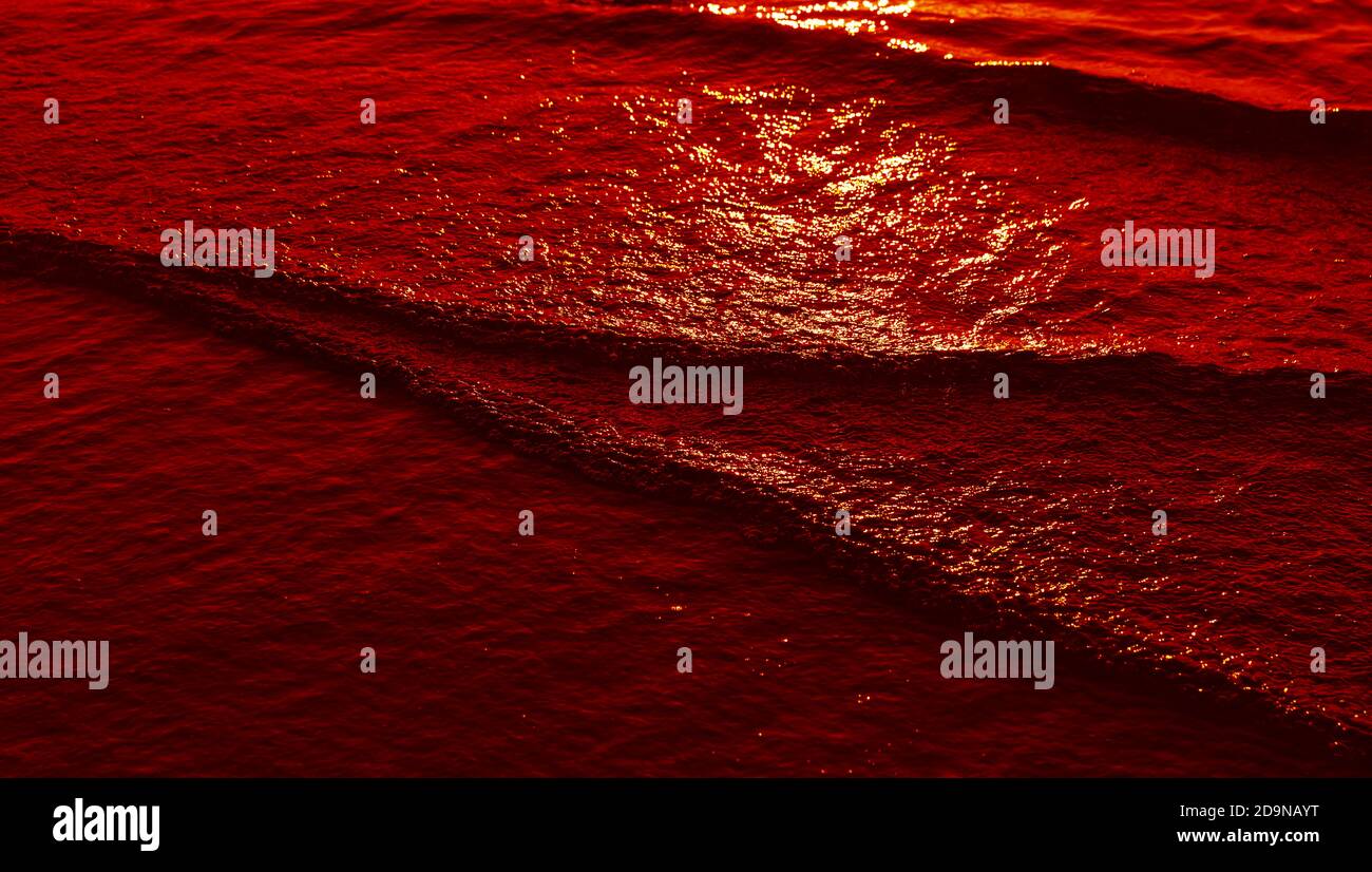Natural background and glare on the surface of the sea. Small waves in ...