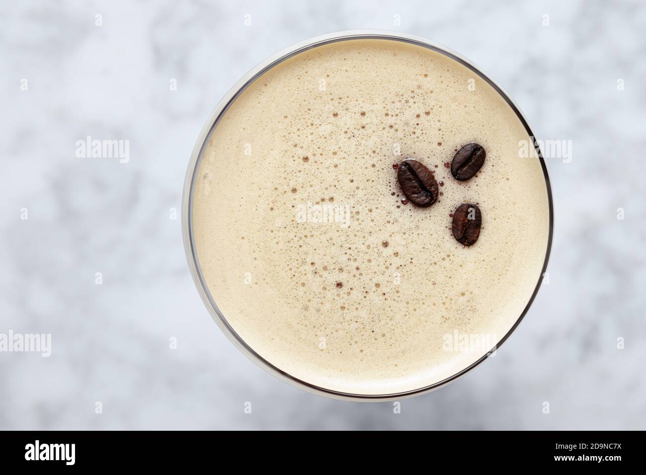 Top view of an Espresso Martini garnished with three coffee beans on a