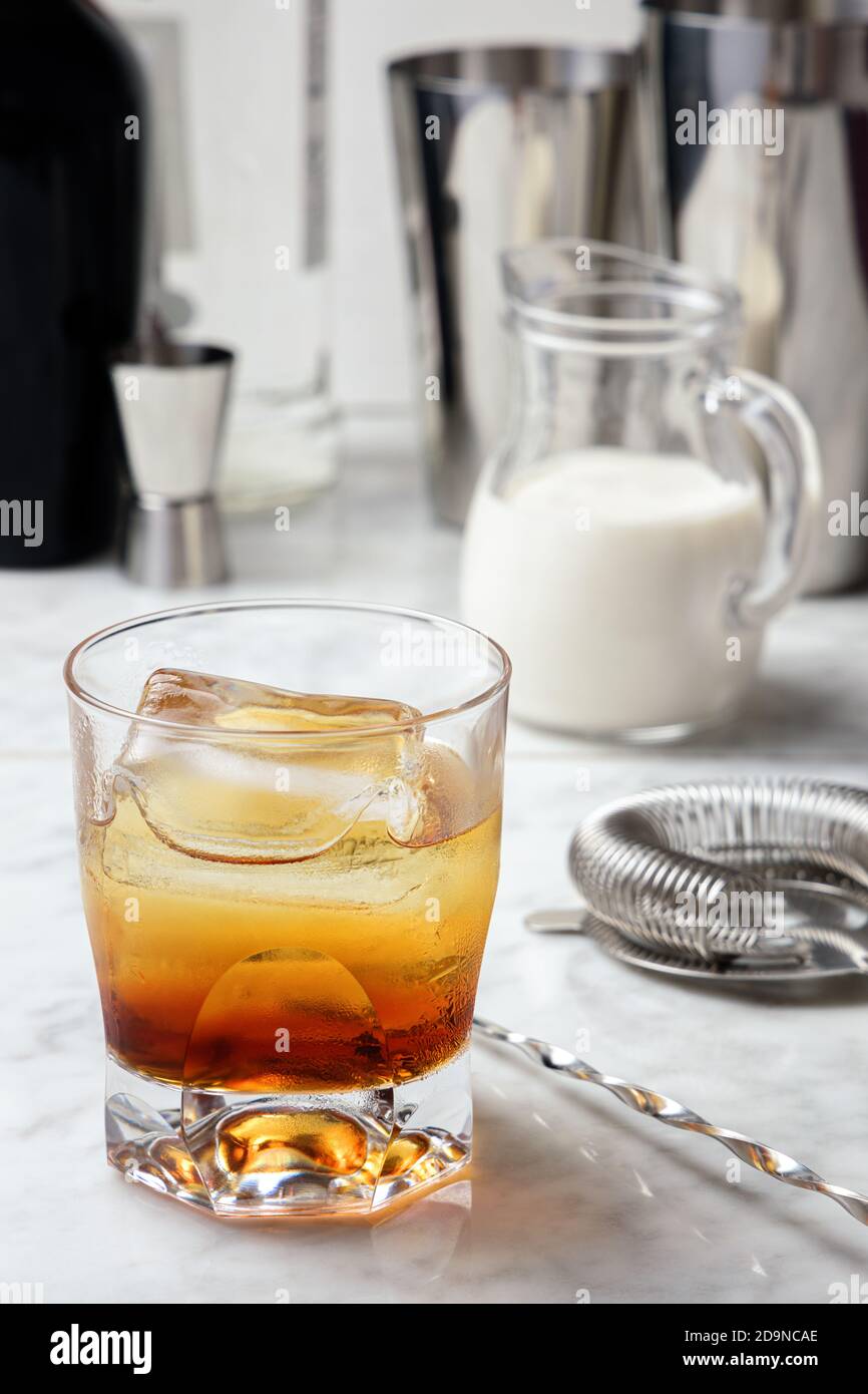 Glass with a mixture of vodka and coffee liqueur. White Russian