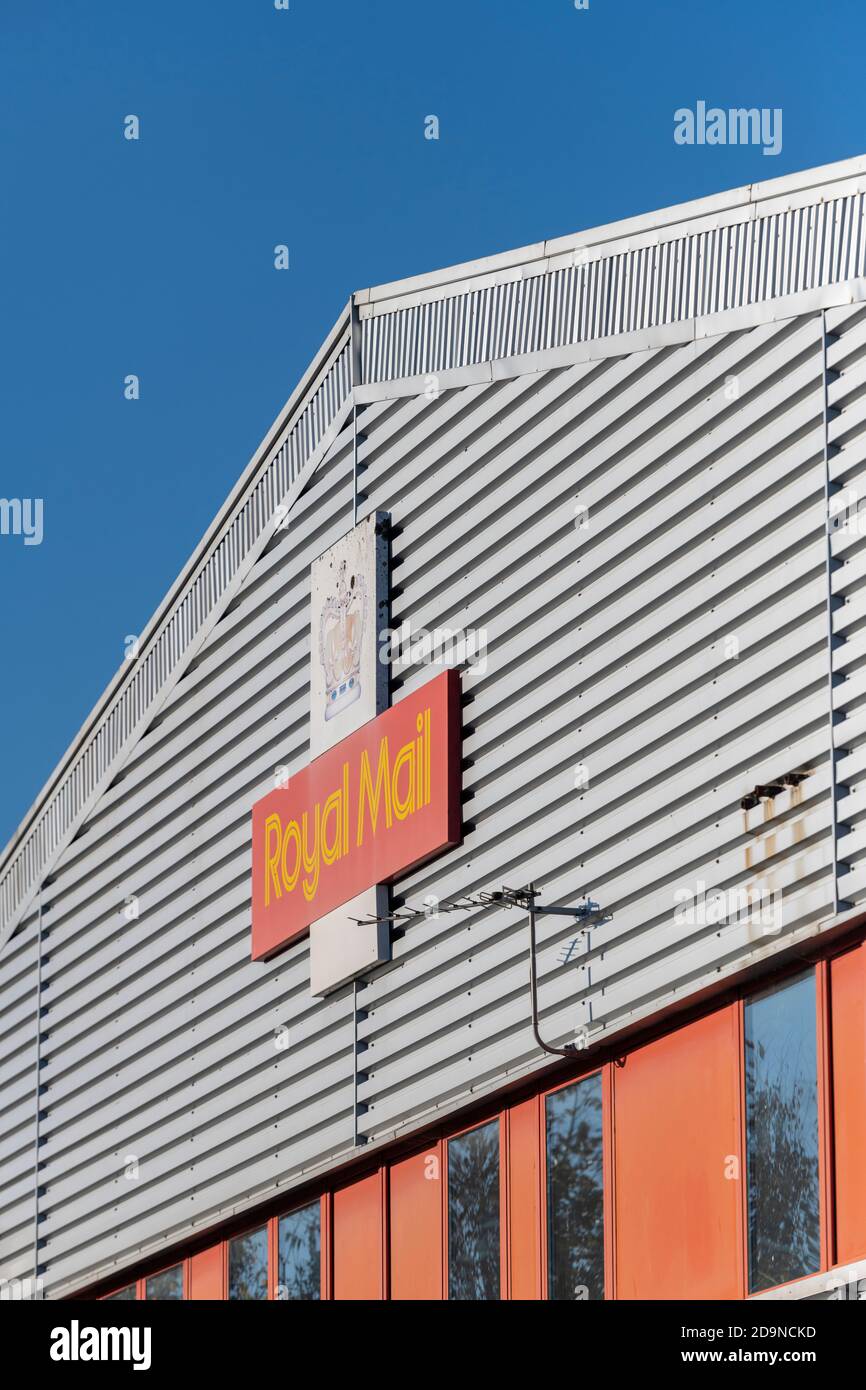 a royal mail sorting office in a large warehouse or factory unit building Stock Photo