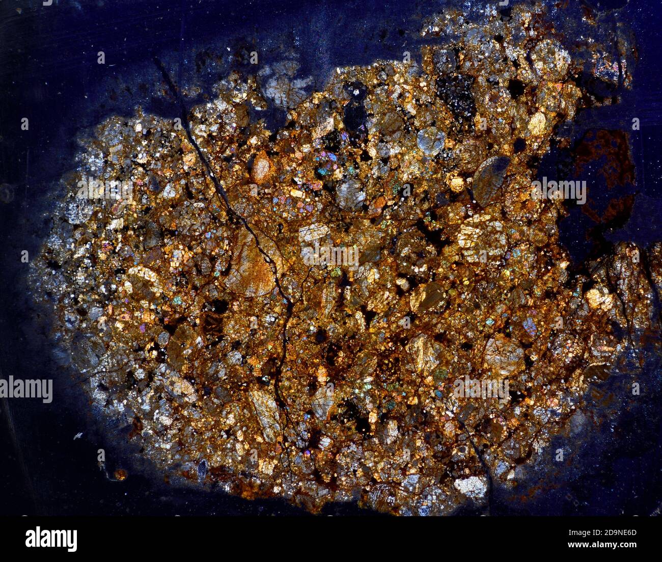 NWA meteorite microscope thin section slide showing chondrules, polarised illumination. Chondrule rich, Sahara desert, Morocco Stock Photo