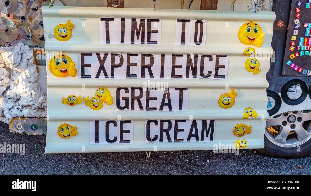 Mackay, Queensland, Australia - 12th July 2019: Icecream for sale sign with smiley faces on mobile vendor truck at markets Stock Photo