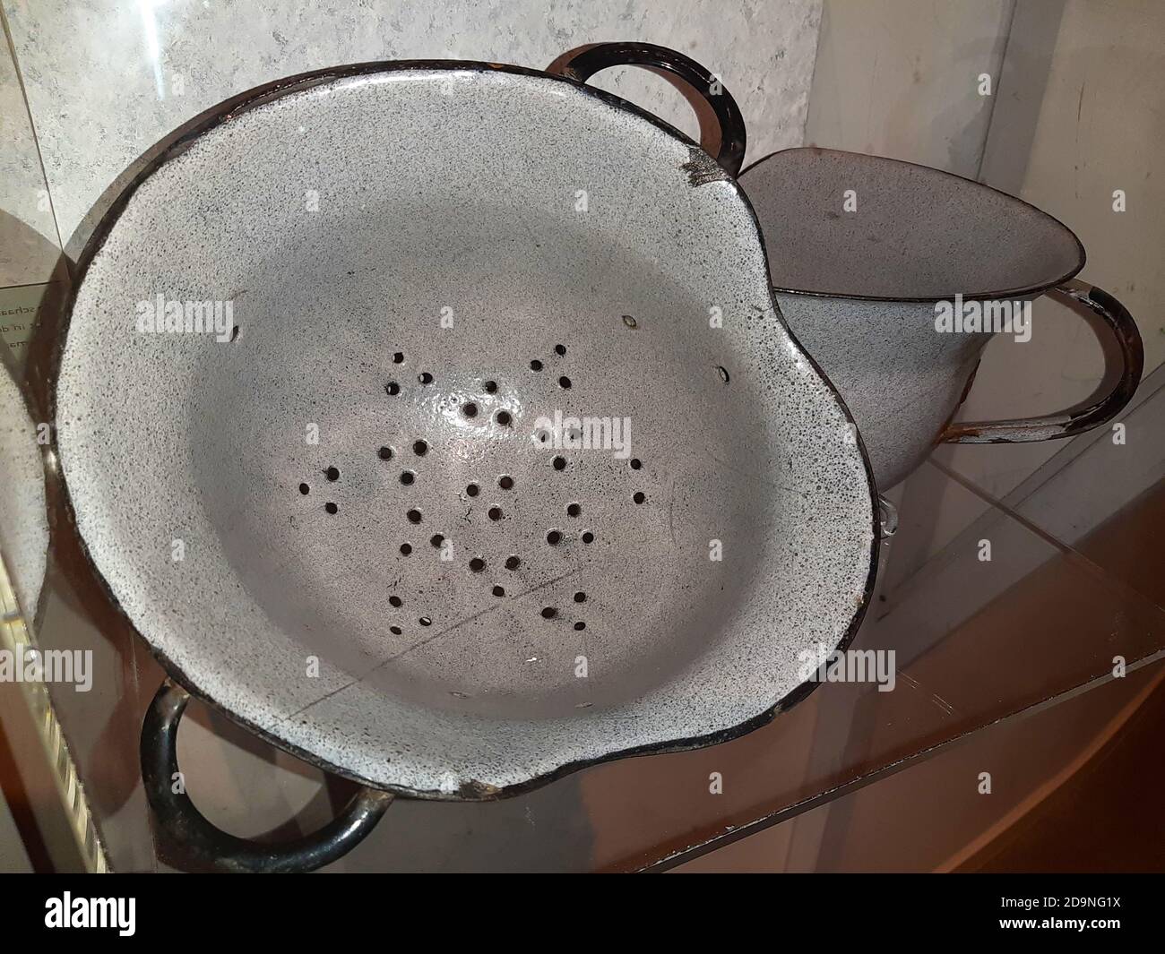 old military helmet transformed into an improvised colander with other
