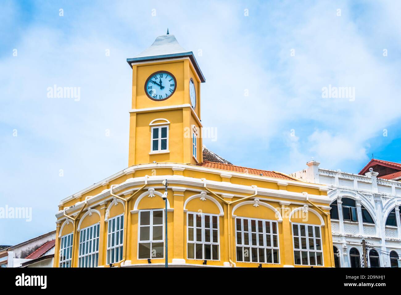 Clock tower at Phuket old town with old buildings in Sino Portuguese