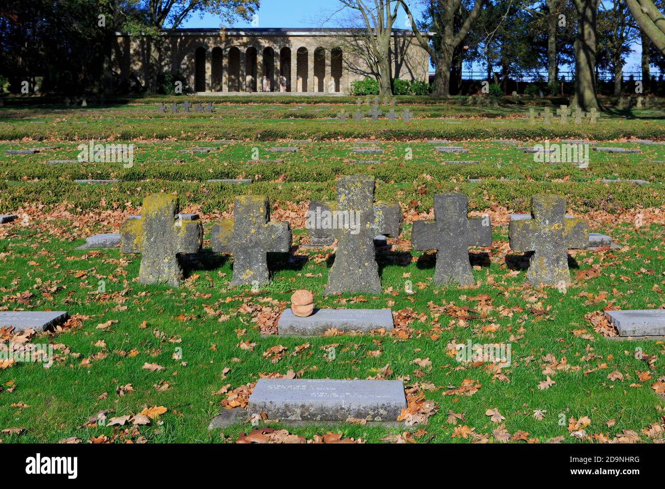 The memorial hall with stone crosses and World War I graves at Hooglede German war cemetery in Hooglede, Belgium Stock Photo