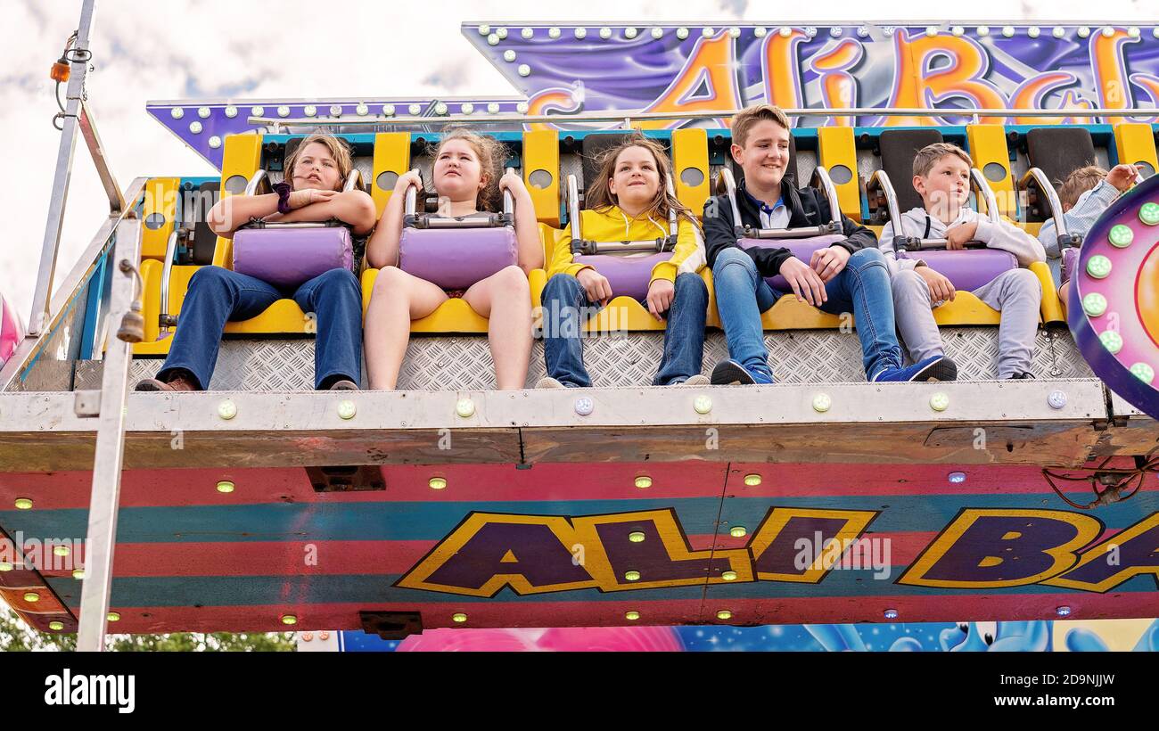 SARINA, QUEENSLAND, AUSTRALIA - AUGUST 2019: People enjoying a high and fast thrill ride at Sarina local country show Stock Photo