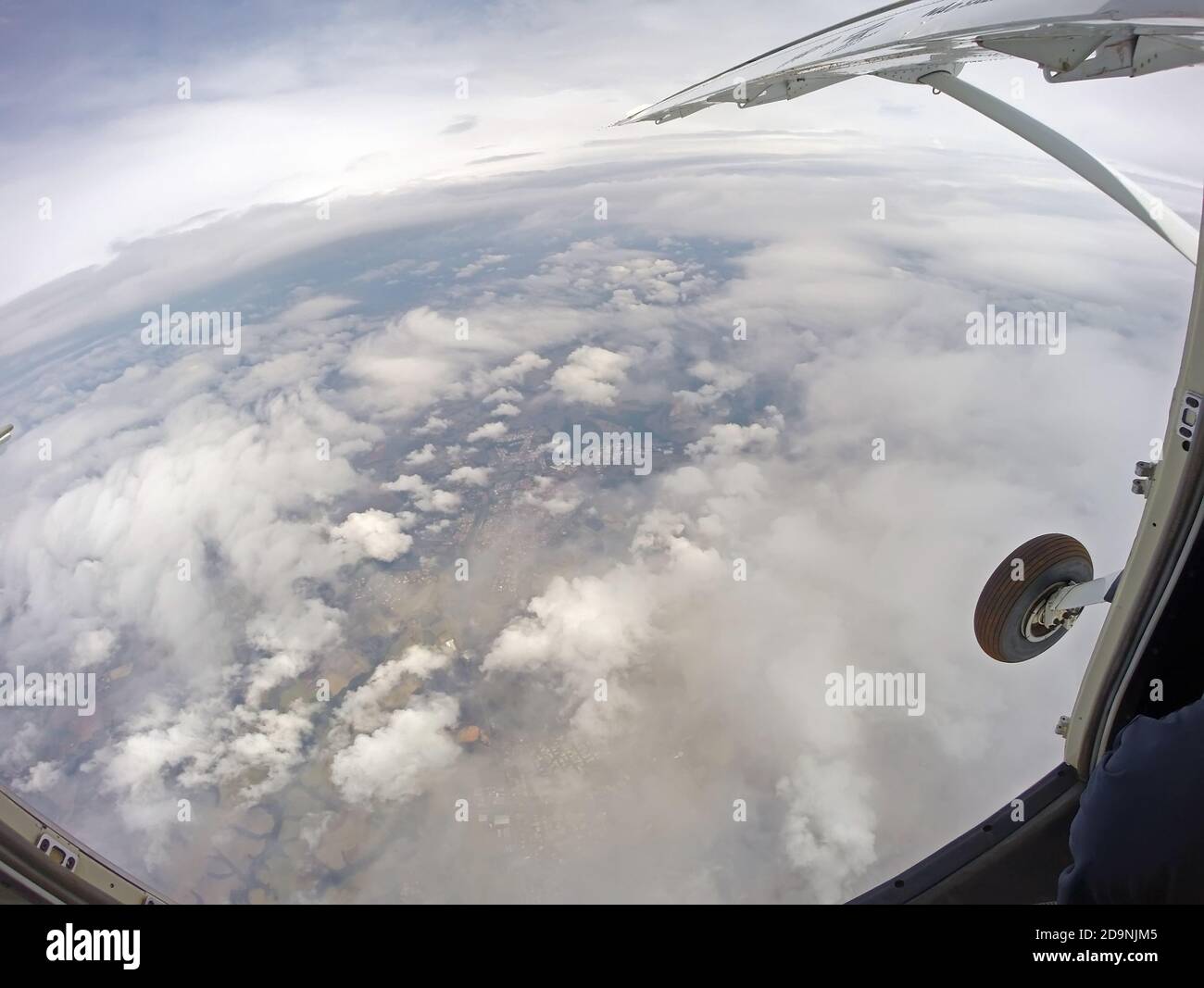 View from inside the parachute plane with the door open Stock Photo