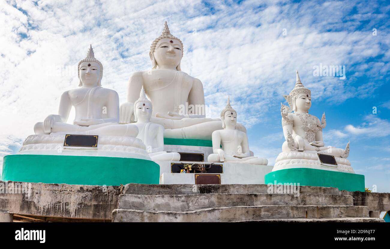 Many white Buddha on blue sky and cloud background Stock Photo