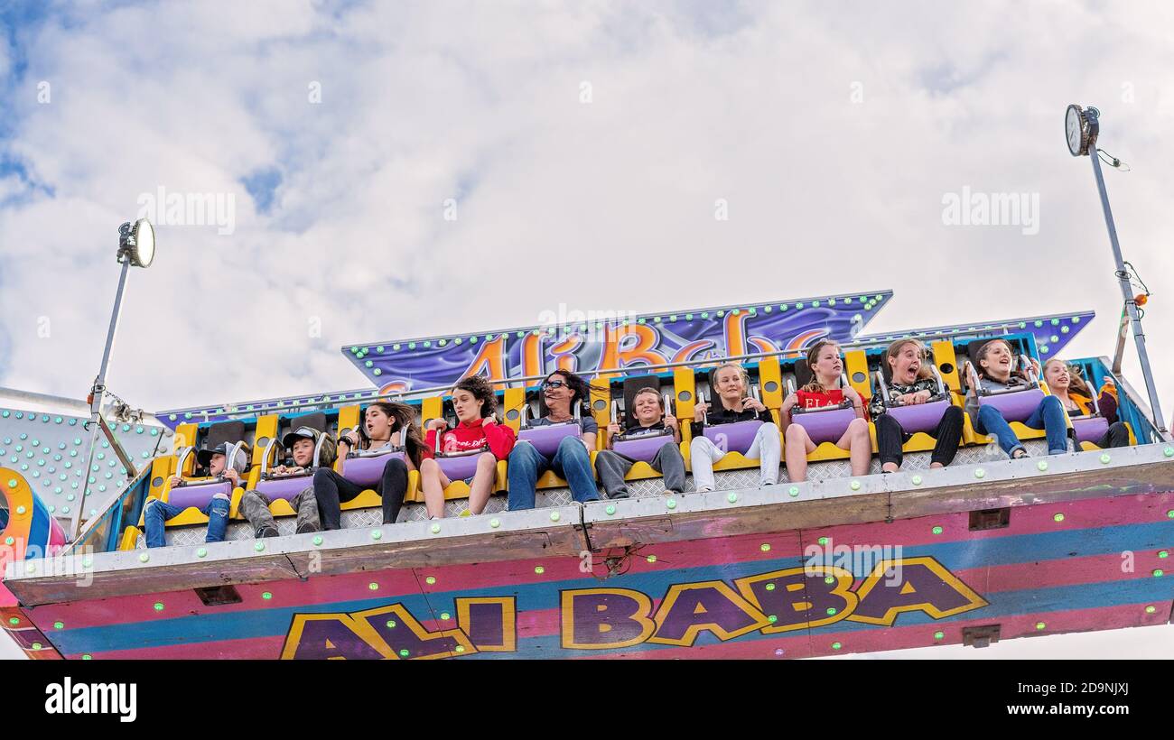 SARINA, QUEENSLAND, AUSTRALIA - AUGUST 2019: People enjoying a high and fast thrill ride at Sarina local country show Stock Photo