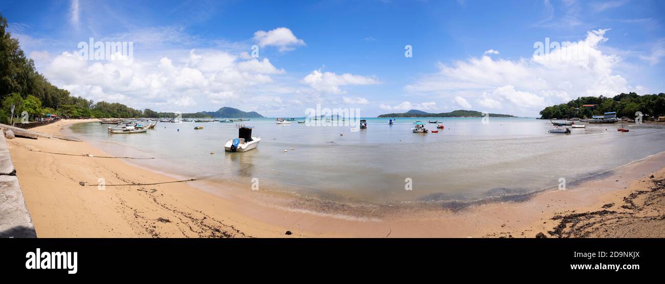 Tropical beach panorama with LongTail boats in the sea blue sky and white clouds in summer season Stock Photo