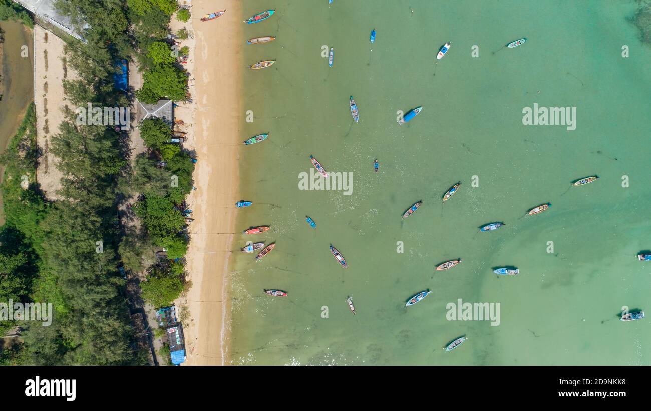 Aerial drone bird's eye view photo Top down of tropical sea with long tail fishing boats at