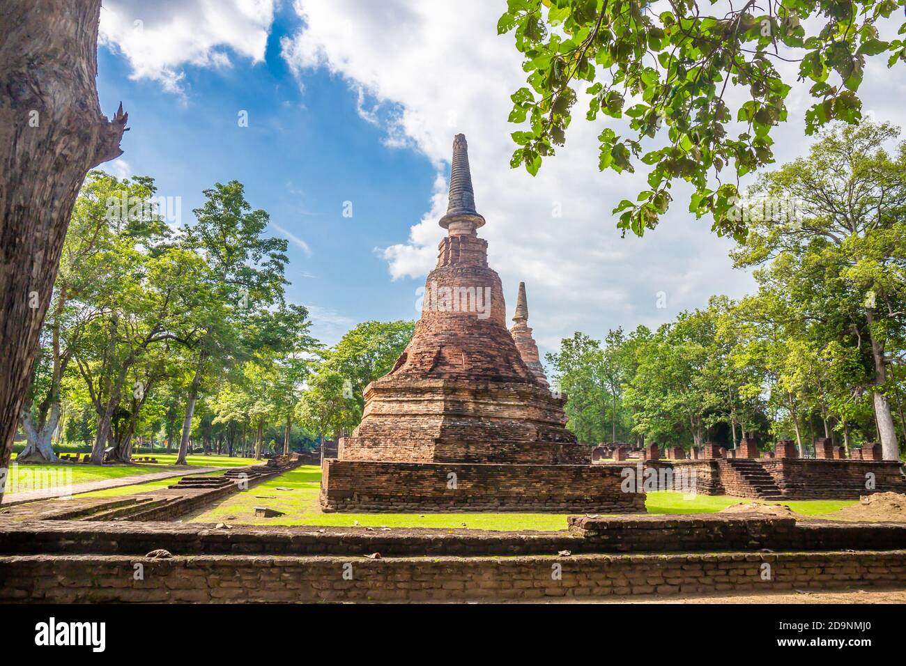 Landmark of old chedi made of ancient bricks in the Kamphaeng Phet Historical Park, Thailand. Stock Photo