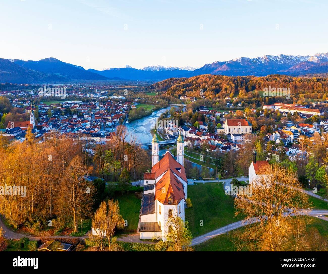 Holy Cross Church and Leonhardi Chapel on Kalvarienberg in the morning light, below city parish church Maria Himmelfahrt and Franciscan Church, Isar, Bad Tölz, Isarwinkel, Alpine foothills, drone image, Upper Bavaria, Bavaria, Germany Stock Photo