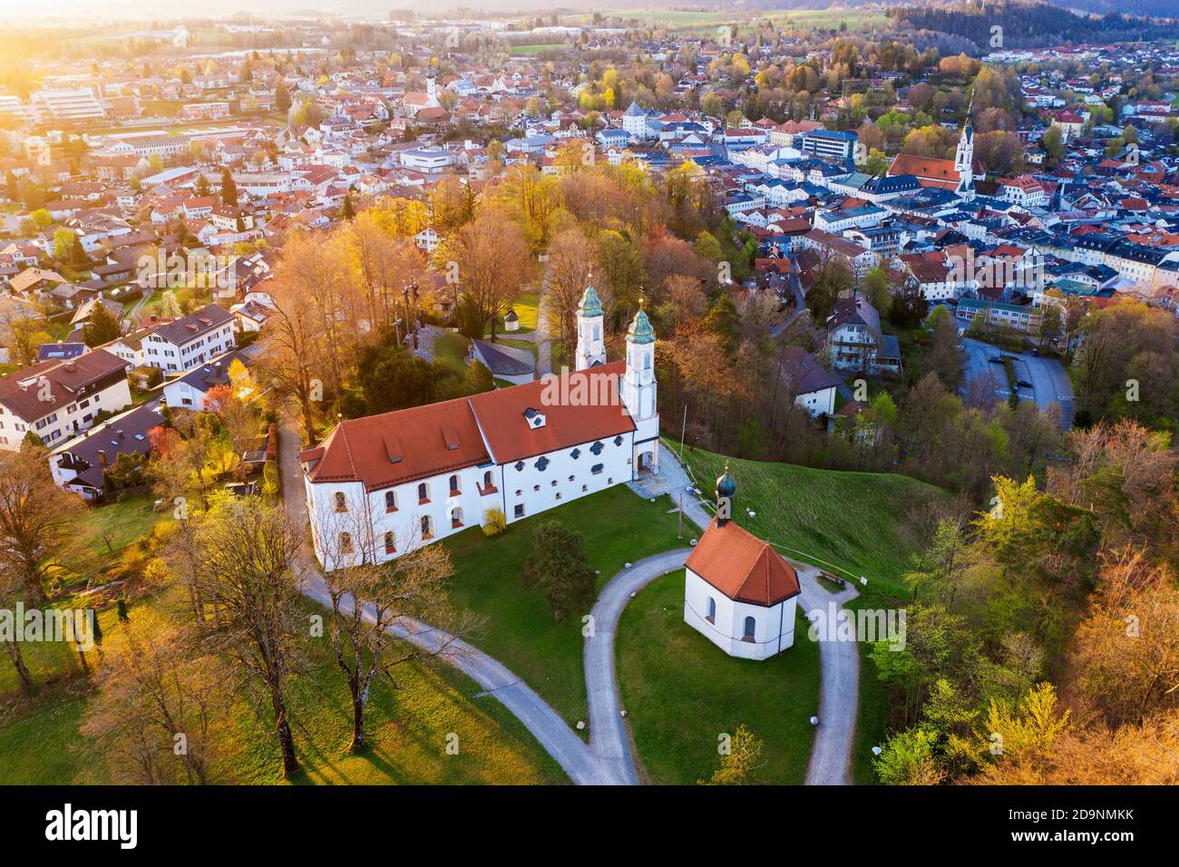 Holy Cross Church and Leonhardi Chapel at sunrise, Kalvarienberg, Bad Tölz, Isarwinkel, Alpine foreland, drone image, Upper Bavaria, Bavaria, Germany Stock Photo