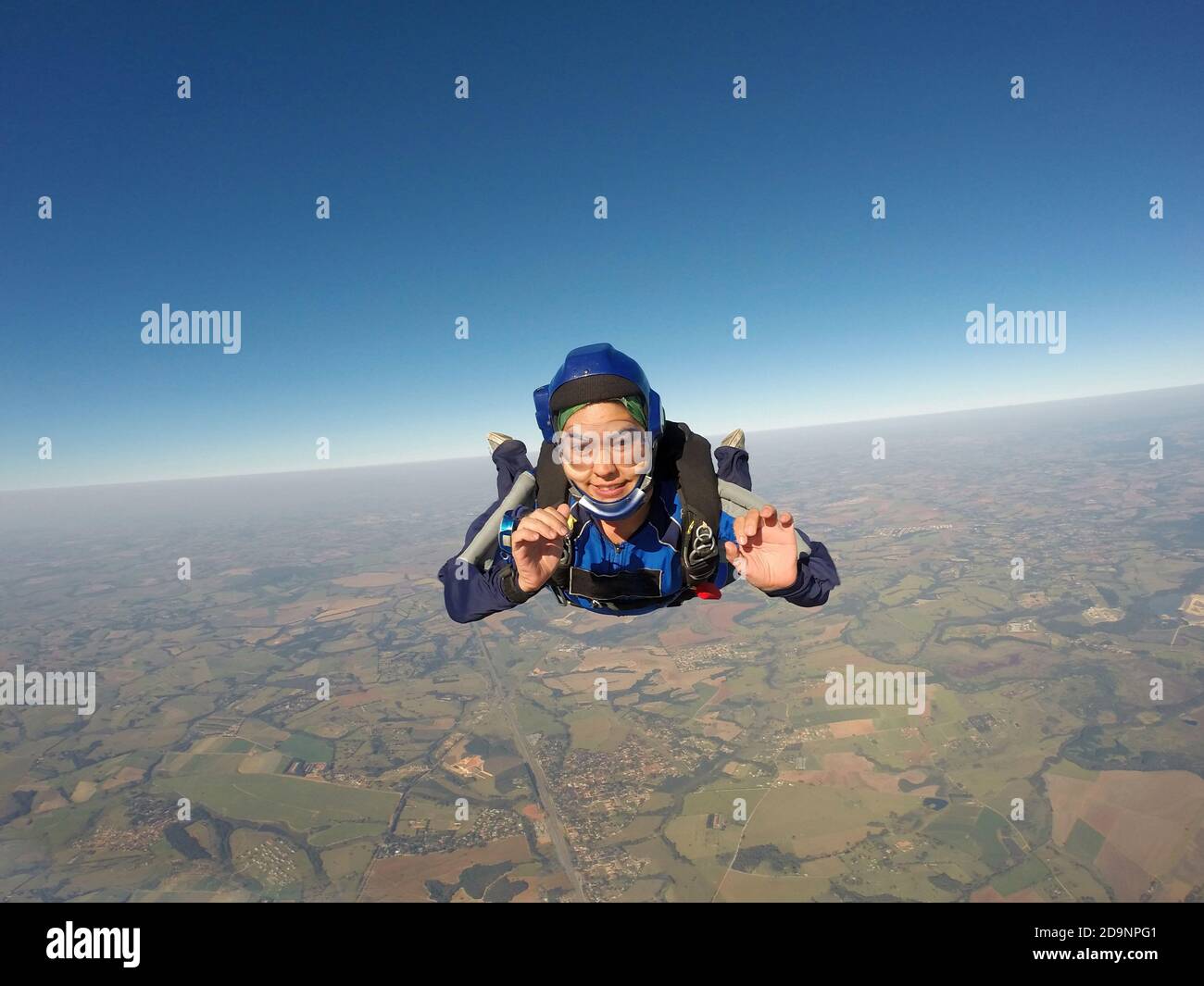 Sky diving asian female smiling Stock Photo