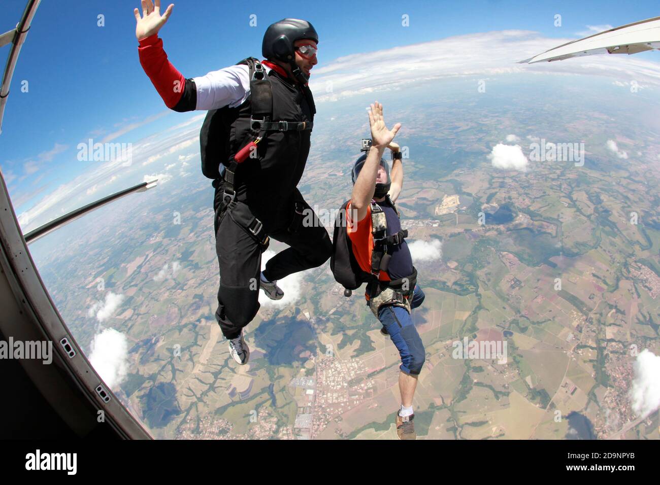 Skydivers jumping out the plane Stock Photo