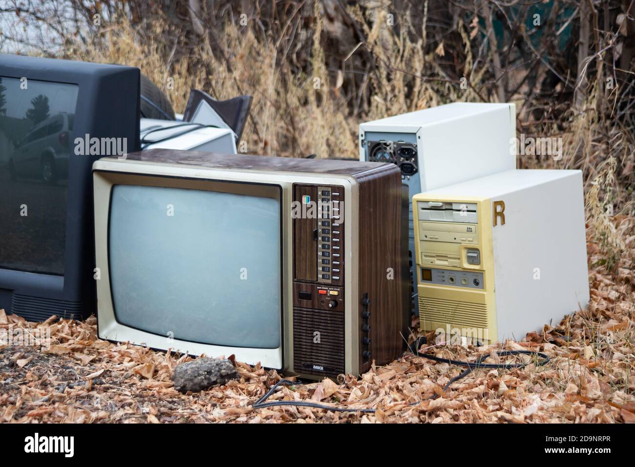electronic recycling waste, pile of old tv, old computers, old technology waiting for recycle Stock Photo
